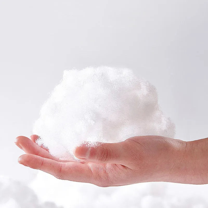 White plastic bone-shaped chew toy for dogs and cats on a plain background.