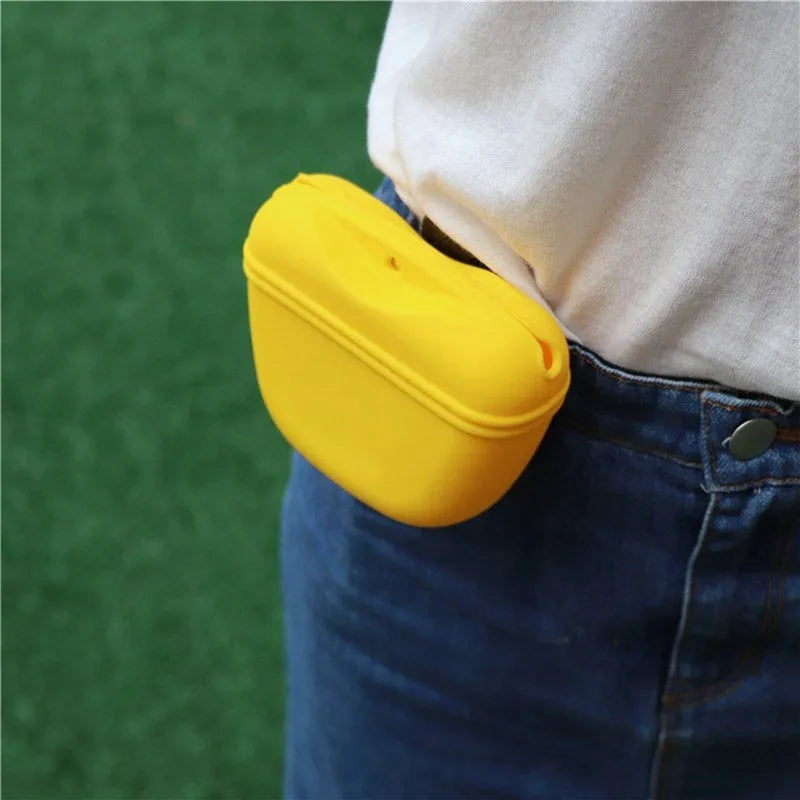 A silicone dog training treat pouch with a clip and magnetic closure, shown in one of six colour options.