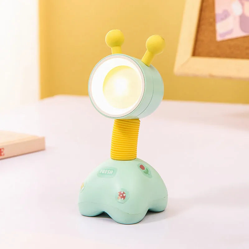DIY cartoon animal small night lamp with magnetic base in assorted colours on a desk.