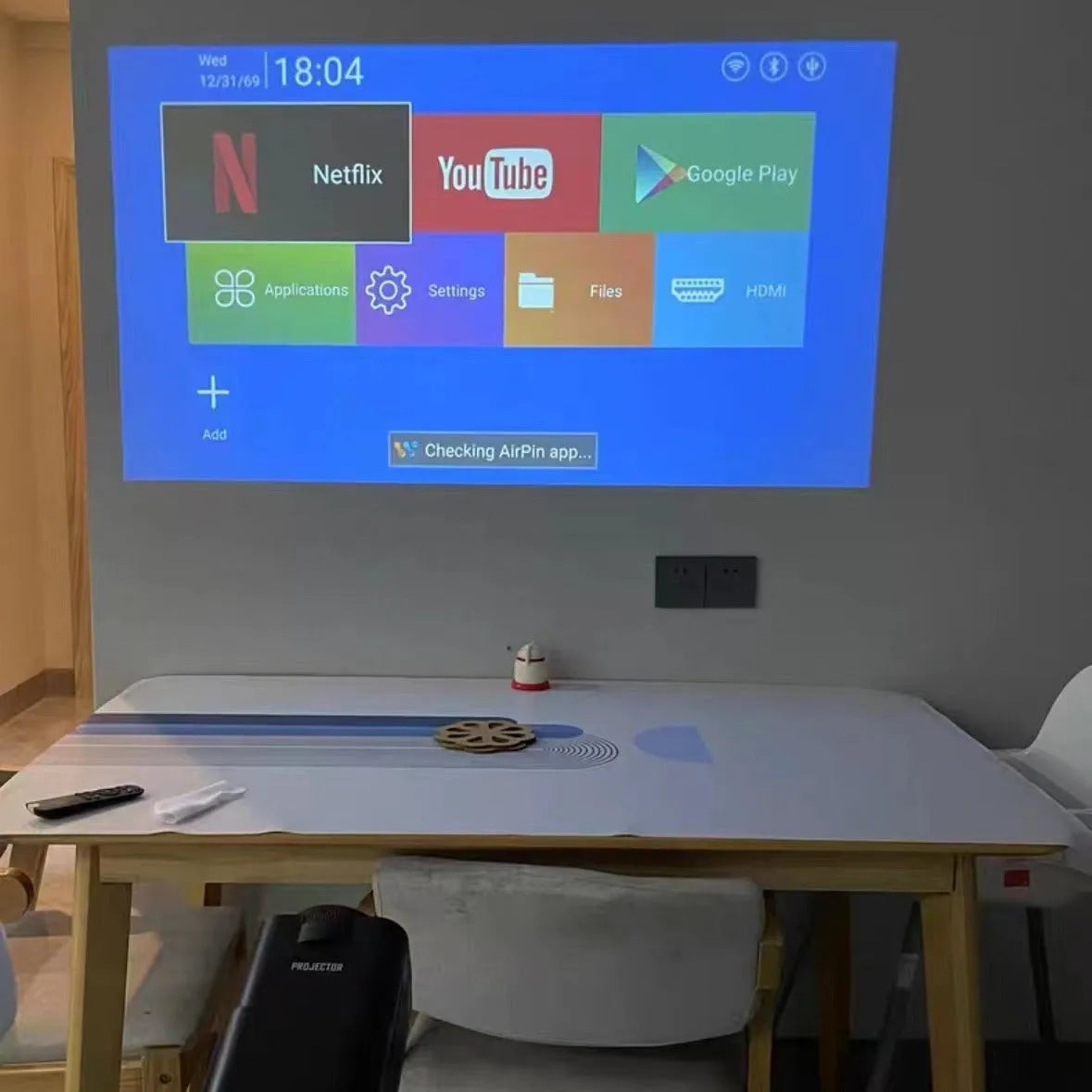 HD wireless home projector with carrying handle for gaming and cinema projection