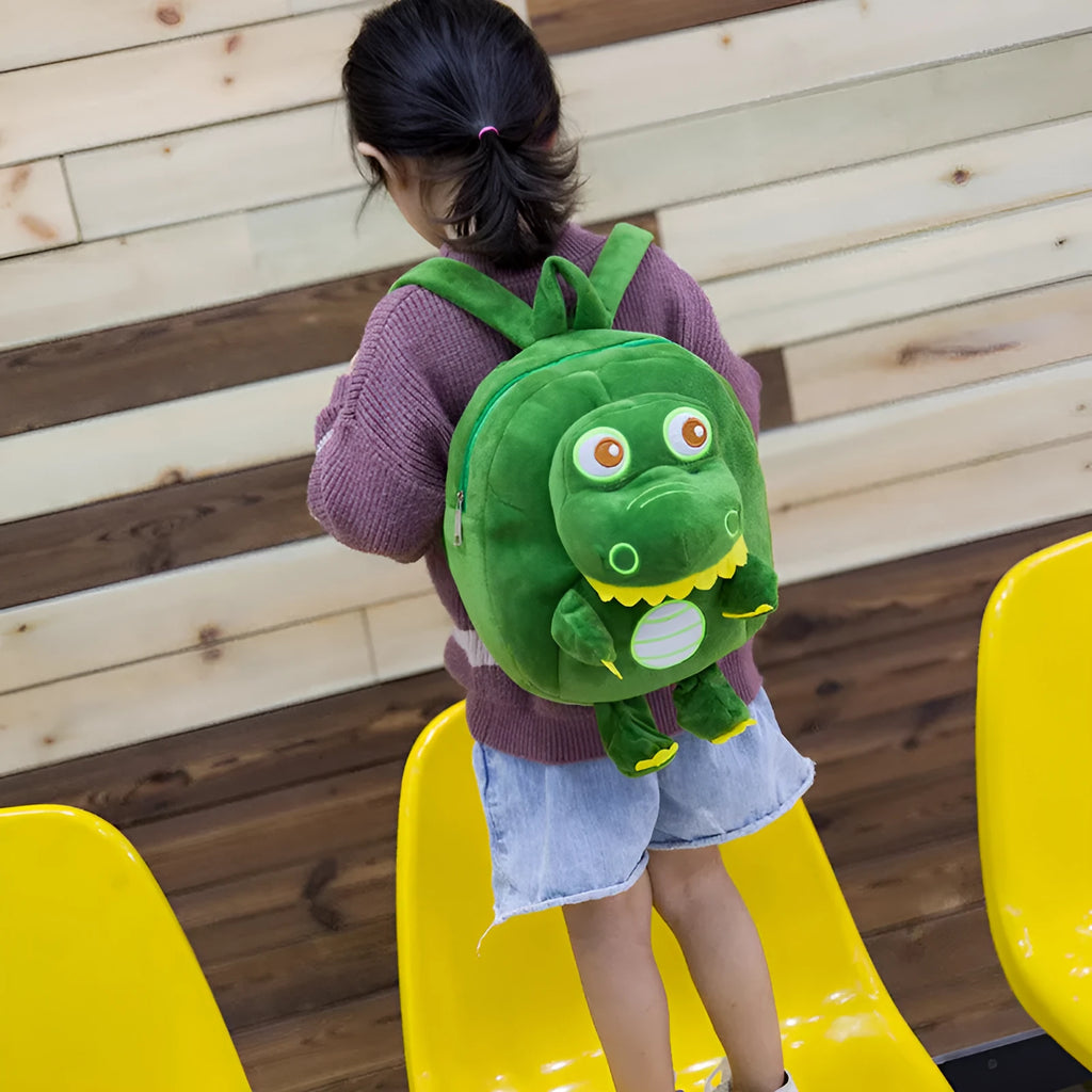 Children's dinosaur plush backpack with embroidery detail and soft handle in blue colour option