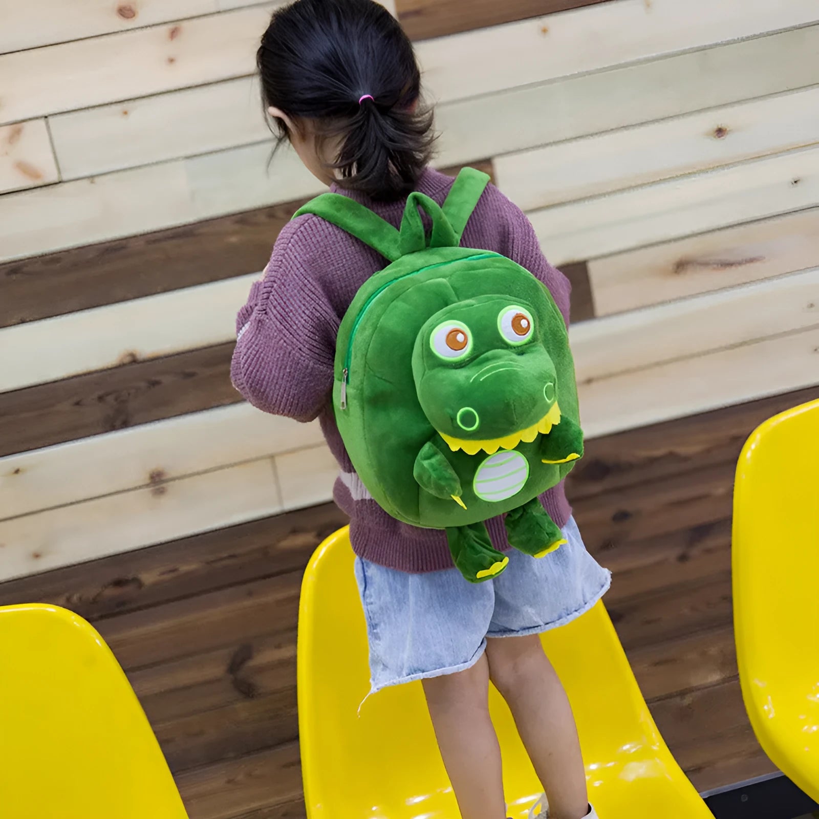 Children's dinosaur plush backpack with embroidery detail and soft handle in blue colour option