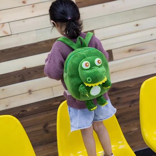 Children's dinosaur plush backpack with embroidery detail and soft handle in blue colour option