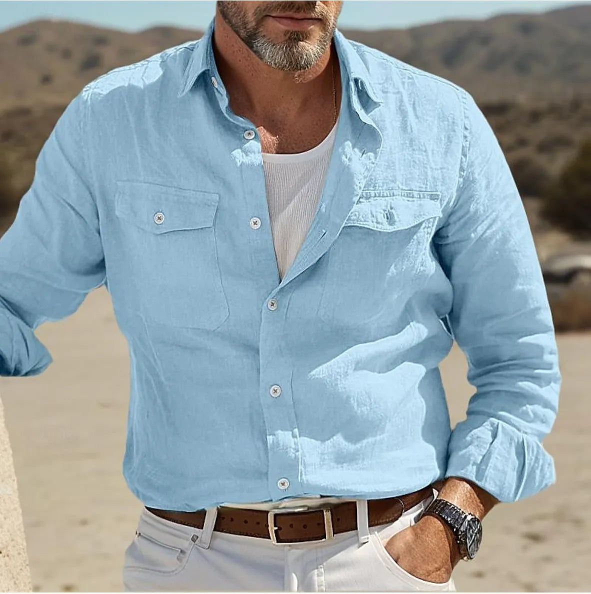 Men's long-sleeved loose fit shirt in a cotton linen blend, shown in solid green colour.
