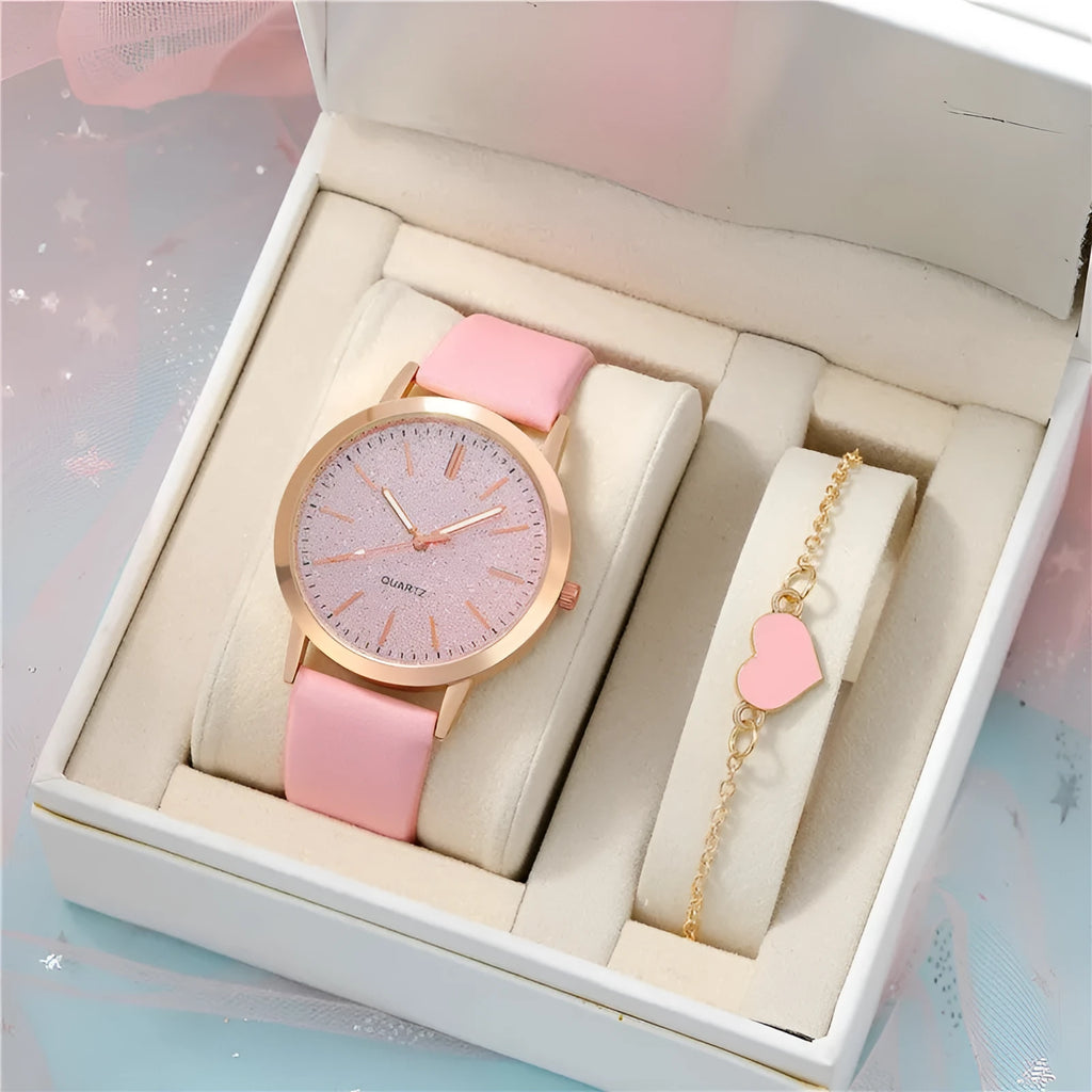 Women's pink quartz watch set with faux leather strap and bracelet on a light background