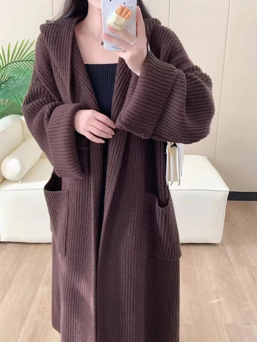 Loose hooded acrylic cardigan coat for women in beige colour with 80cm length and raglan sleeves