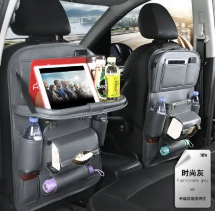 Black PU leather car seat back organiser with multiple pockets and a built-in trash can compartment