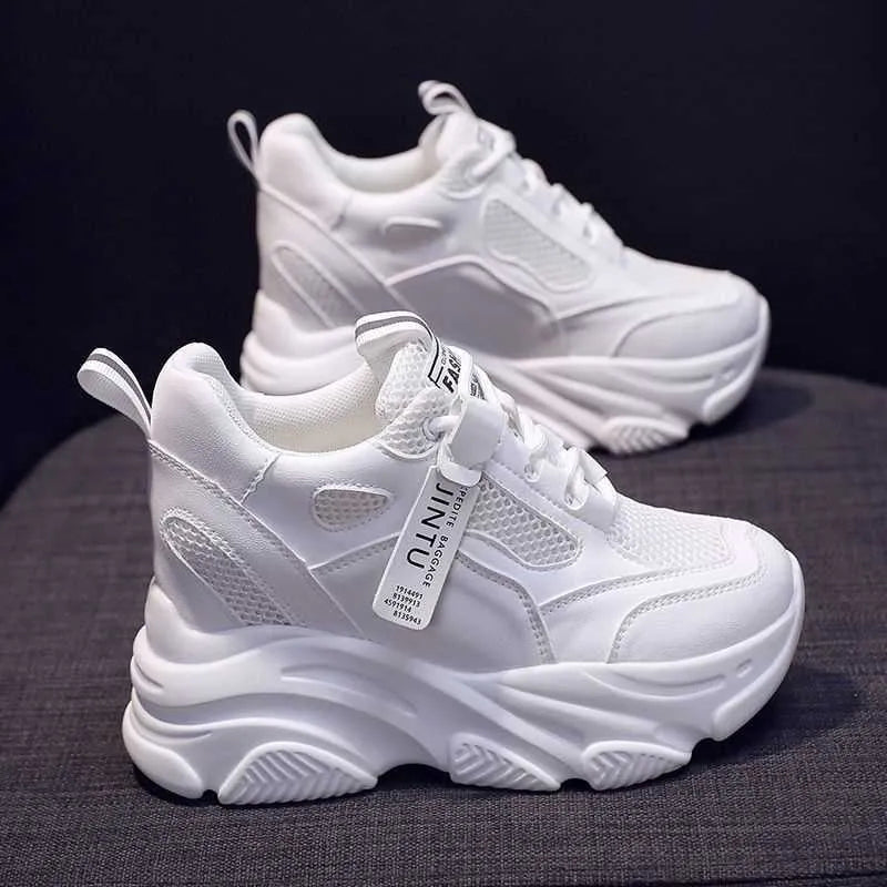Men's black casual platform shoes with mesh upper and hollow out design on a white background.