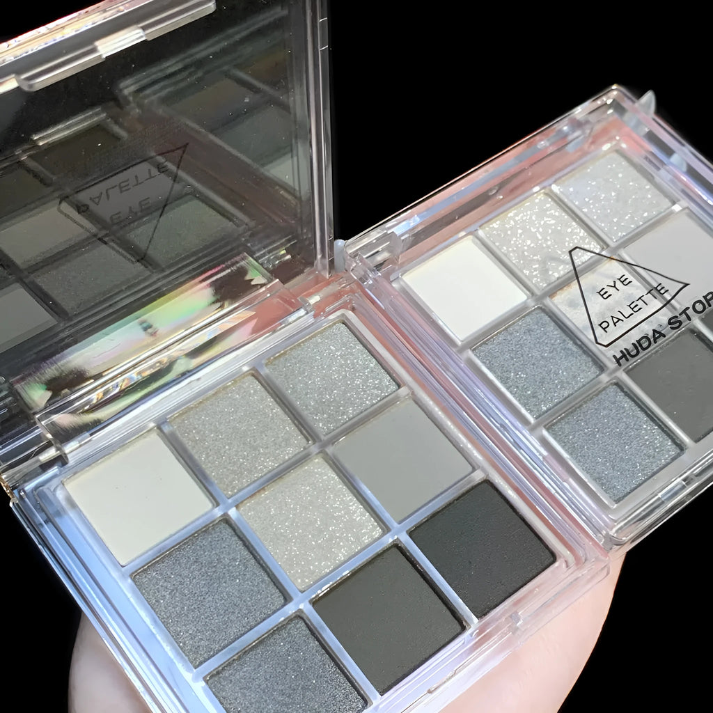 Smoked design nine colour eyeshadow palette open showing white, silver, black, iron grey shades.