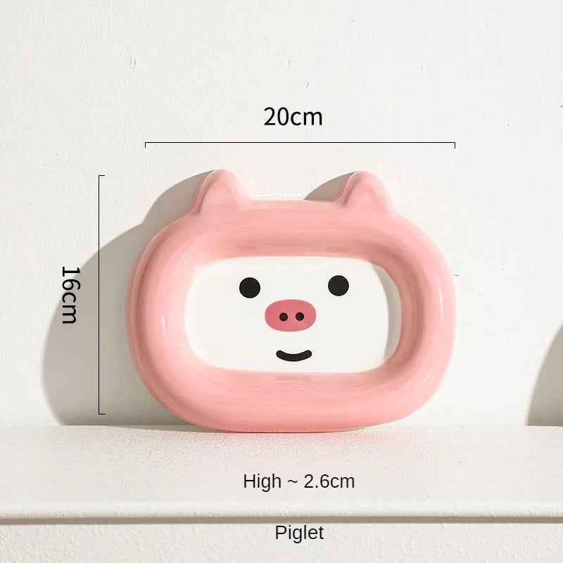Ceramic pet bowl with an animal design, shown on a table.