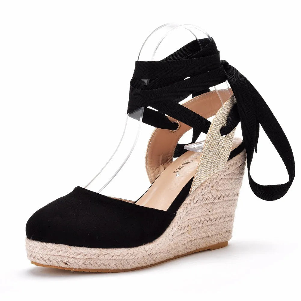 Women's apricot bohemian wedge sandals with bead decorations, tassels, and a buckle fastener on a white background.