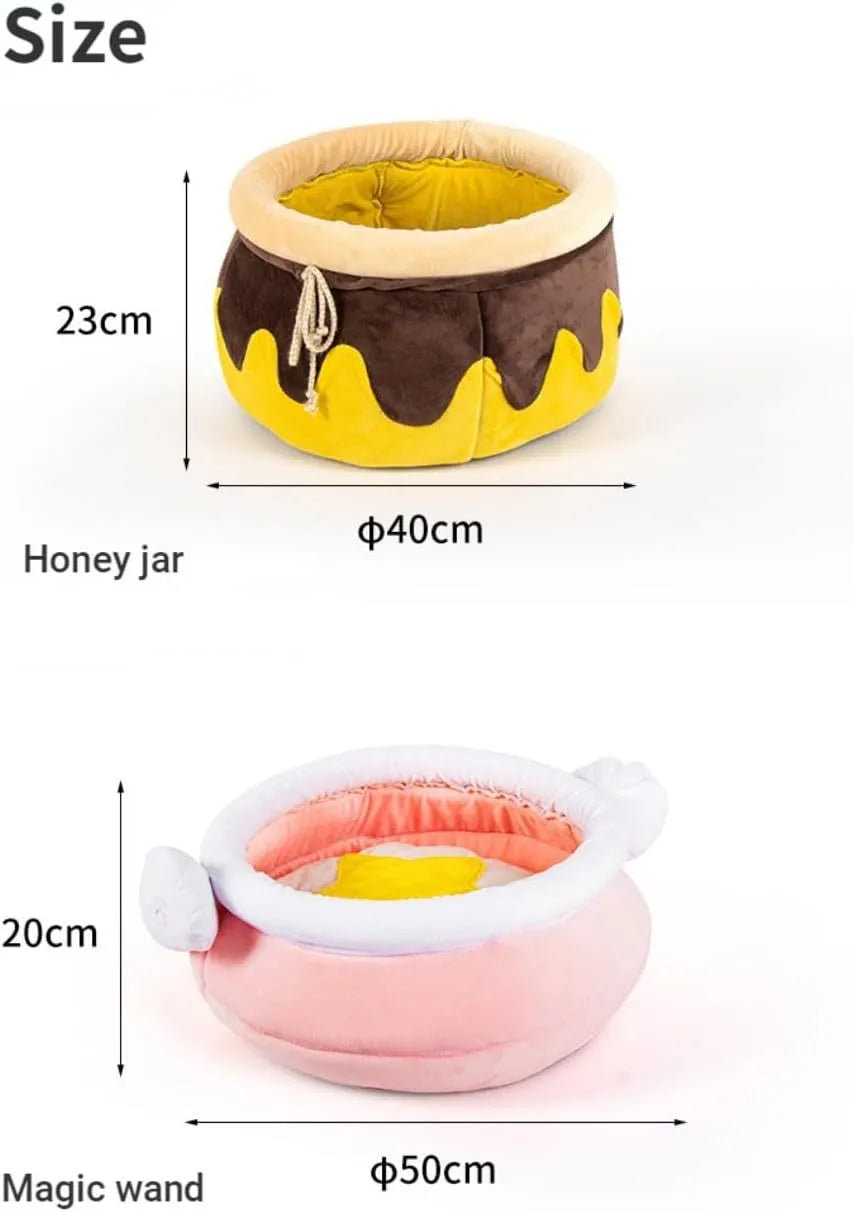 Pink honey pot-shaped cat bed with magic wand design and a soft, removable inner cushion.