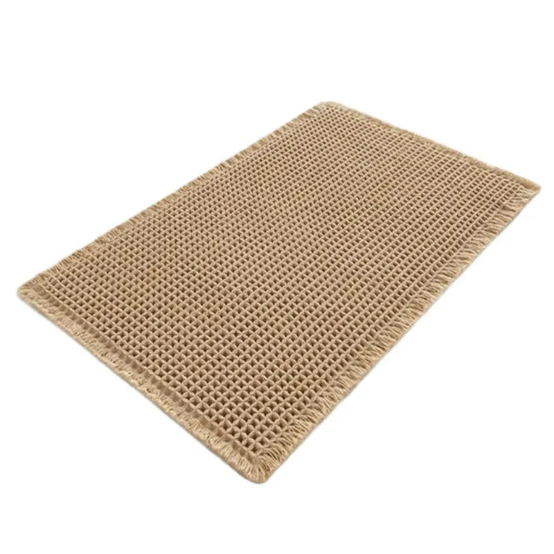 A square, checkered-pattern absorbent bathroom floor mat with a non-slip backing, shown in a neutral colour.