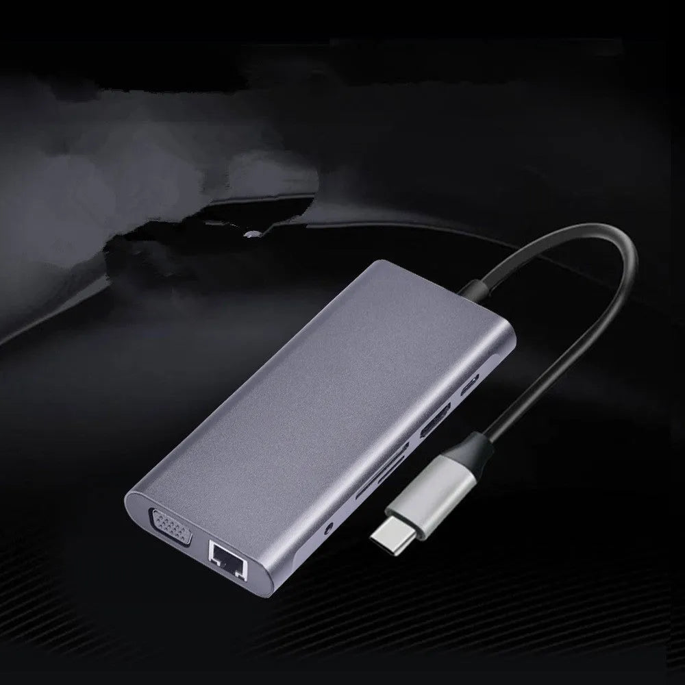 Silver 10-in-1 USB-C docking hub for MacBook with multiple ports including HDMI, USB, and SD card slots.