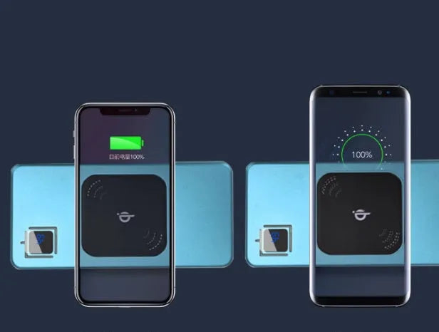 Silver coloured portable power bank with LCD display showing battery percentage, placed next to a mobile phone.