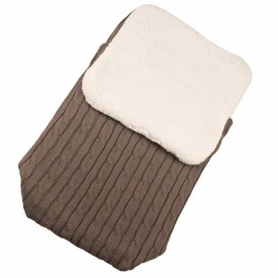 Envelope-style baby stroller sleeping bag in a choice of colours with cotton wool filling.