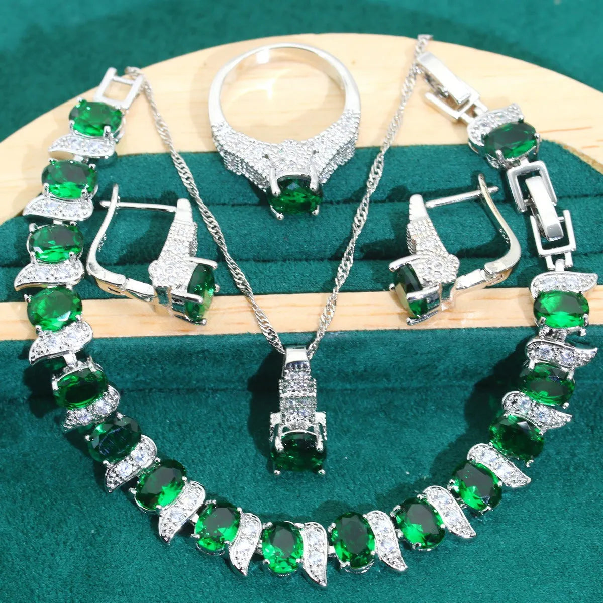 Four-piece bridal zircon jewellery set with necklace, earrings, bracelet and ring in water wave chain design