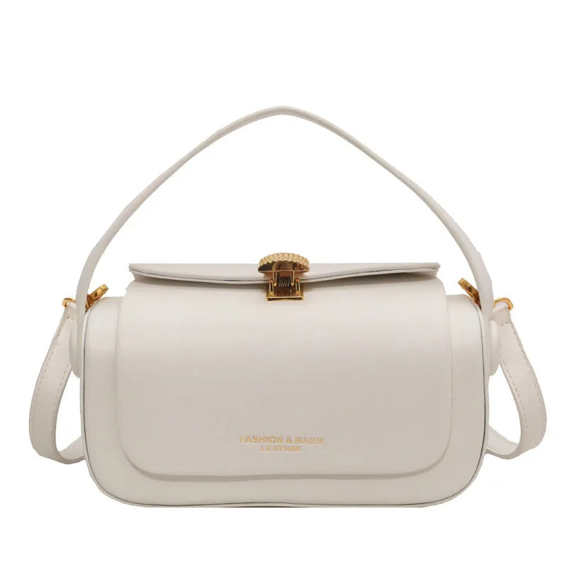 Women's personalised black PU leather shoulder messenger bag with letter detail and stitching.