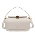 Women's personalised black PU leather shoulder messenger bag with letter detail and stitching.