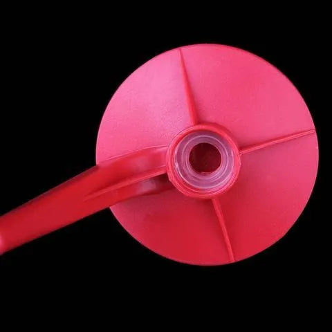 Red plastic Magic Tap soda dispenser attached to 2-litre bottle for push-button pouring