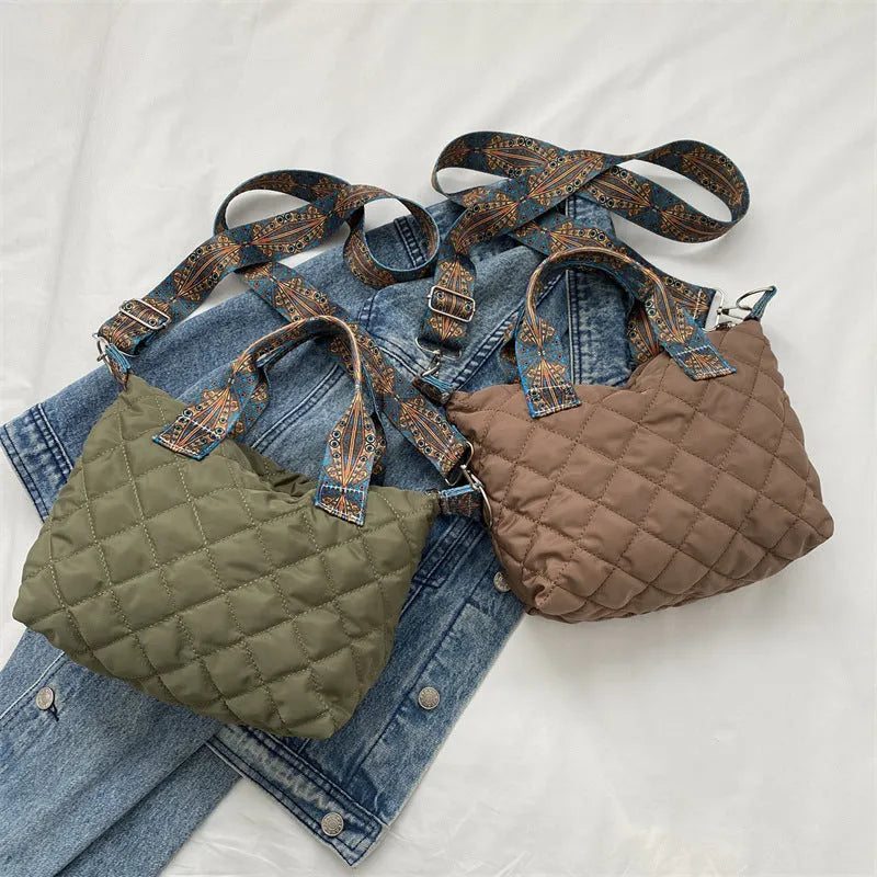 A soft Oxford cloth messenger bag in a horizontal square shape with a single shoulder strap, shown in one of five available colours.