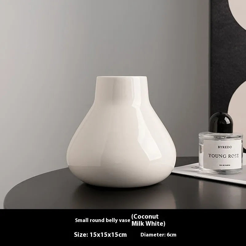 Ceramic decorative vase with artificial flowers in black or white modern design