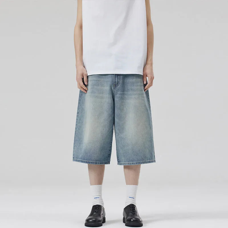 Men's straight leg cropped denim shorts in light blue, shown laid flat.