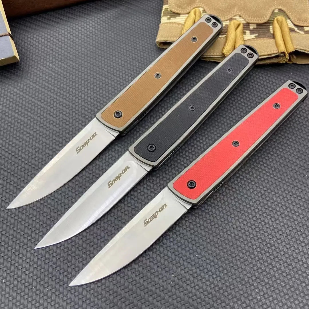 Closed and open views of a folding fruit knife with stainless steel blade in black, brown, or red handle options.
