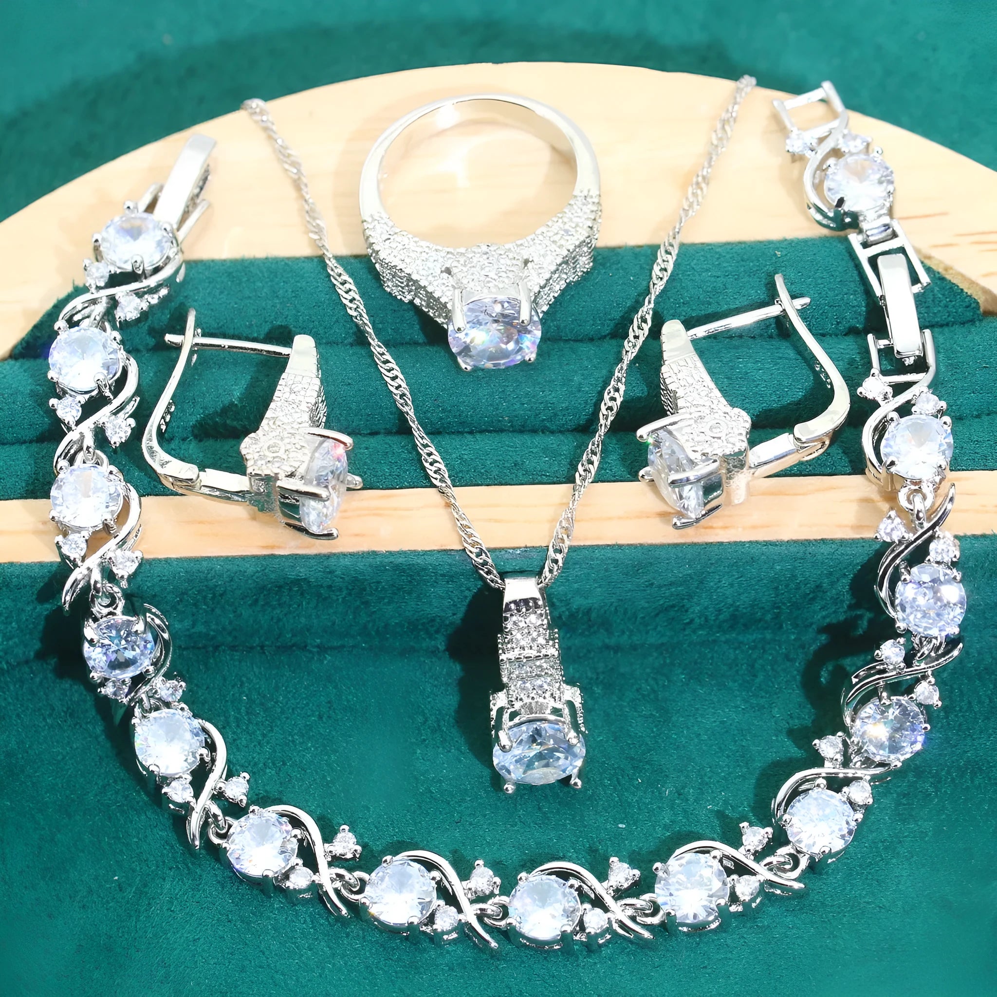 Four-piece bridal zircon jewellery set with necklace, earrings, bracelet and ring in water wave chain design
