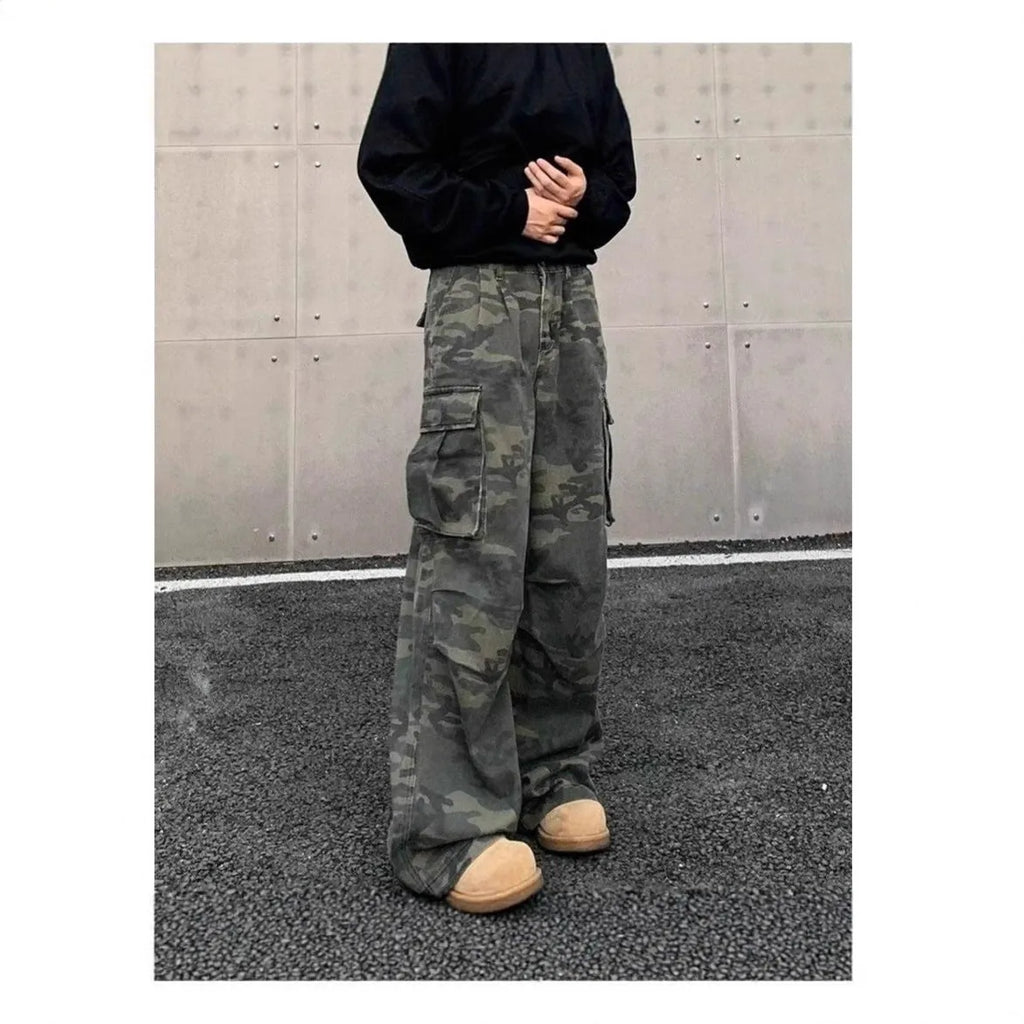Korean style washed camouflage cargo trousers on a hanger, showing multiple pockets and mid waist design.