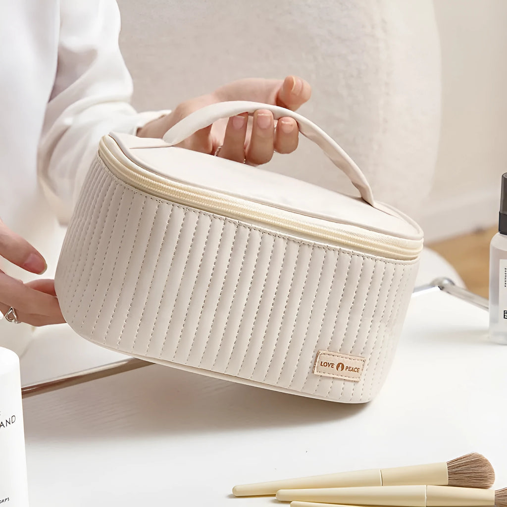 Open-top solid colour PU leather makeup bag in light blue on a white surface