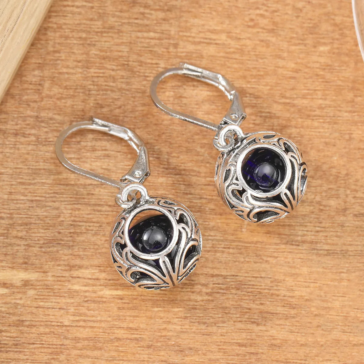 Silver geometric pendant earrings with vintage engraving and blue gemstone accents