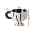 Hand-pinched irregular ceramic mug in solid colour, approximately 250ml capacity