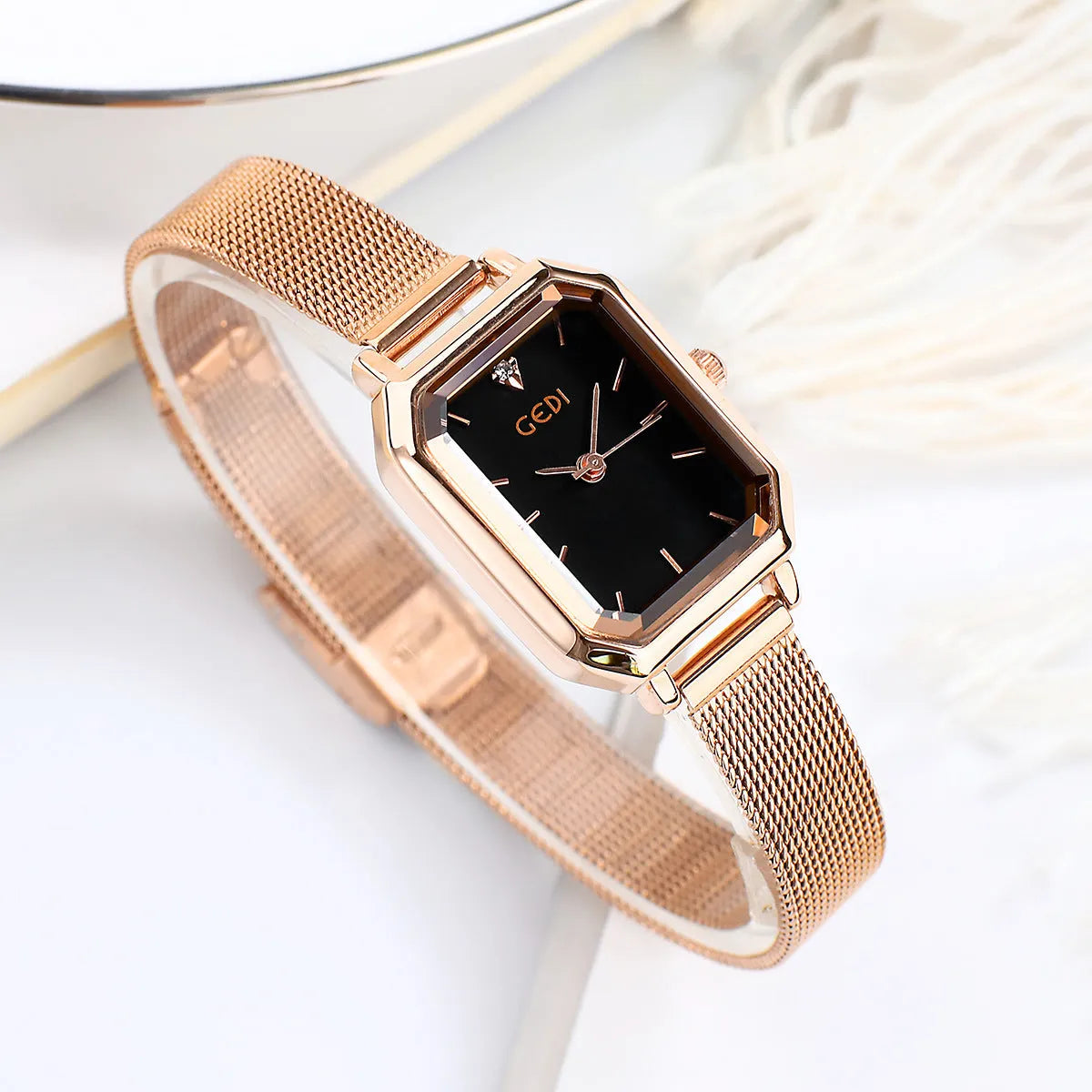 Women's casual retro square watch with rose gold shell and black dial on black strap