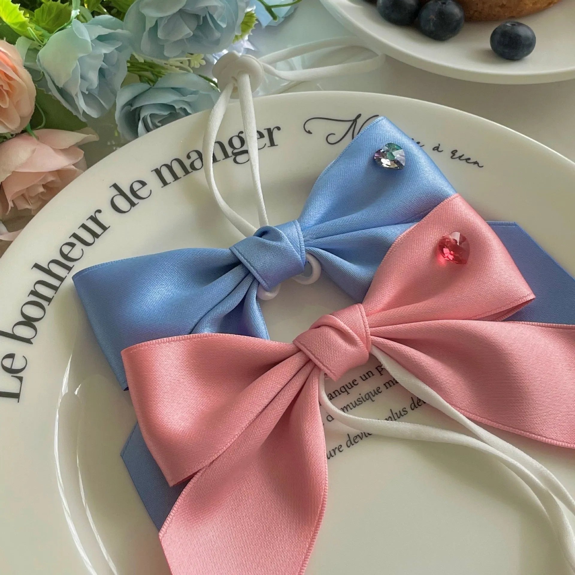 Princess style dog hair band with bow tension adjustment on small dog