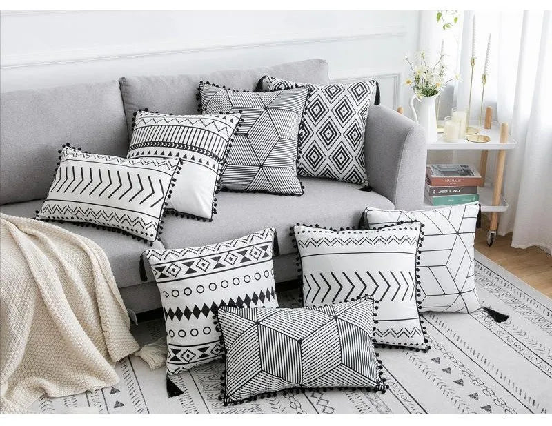 Bohemian style throw pillow on a sofa, available in light grey, black, or white, shown in 45x45cm size.