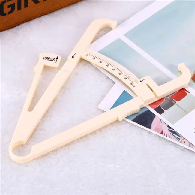 Clear acrylic body fat caliper with measurement scale showing 200mm range and 0.001mm accuracy.