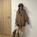 Women's triangular cashmere blend shawl cape with tassel details in various colours
