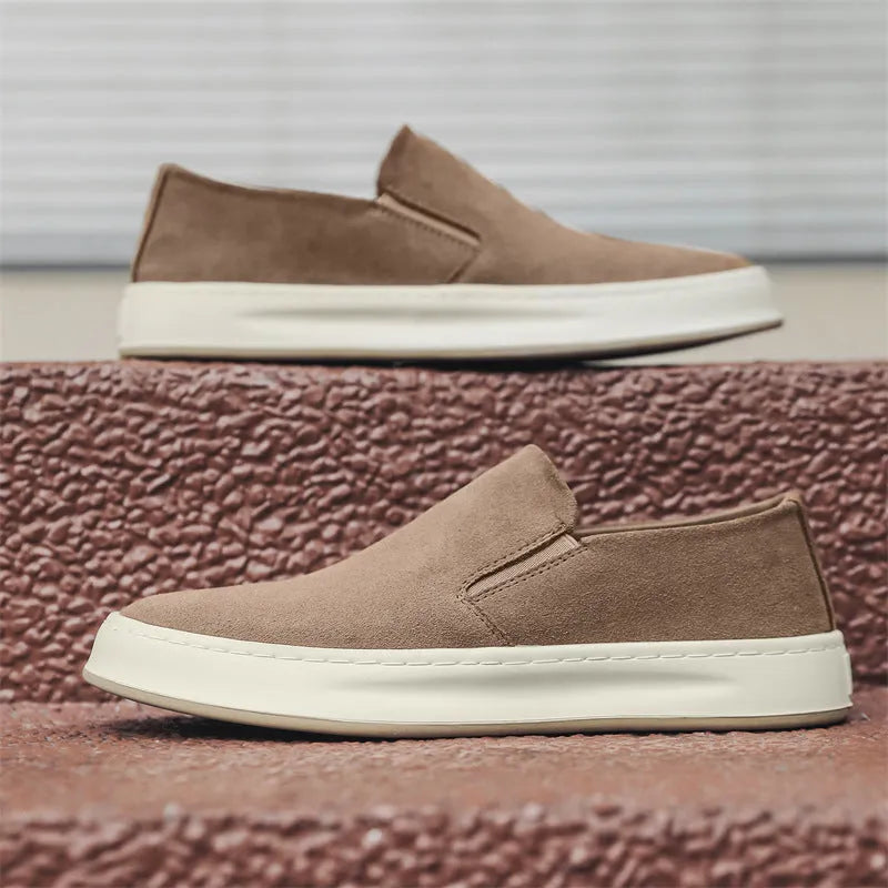 Men's grey casual shoes with round toe and sewing line detail on PU upper