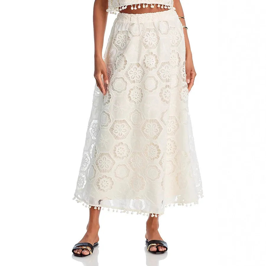 White women's polyester two-piece suit with embroidered retro art design, featuring sleeveless top and long skirt
