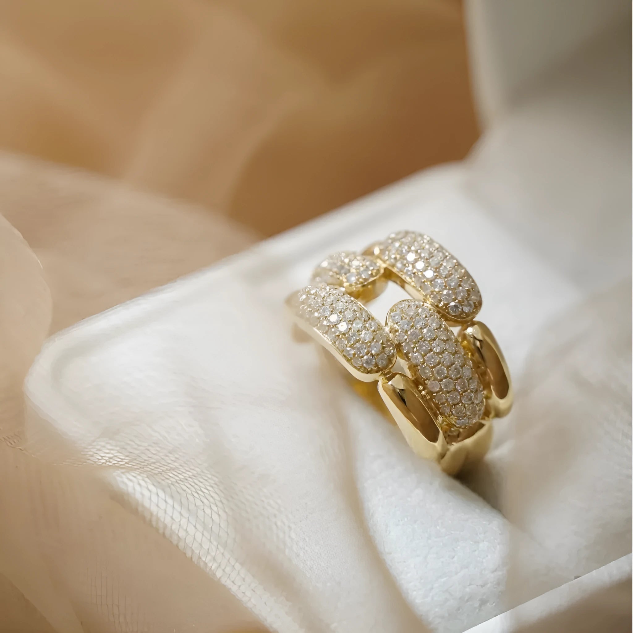 S925 sterling silver geometric ring for women with yellow gold finish and gang drill pattern on pink background