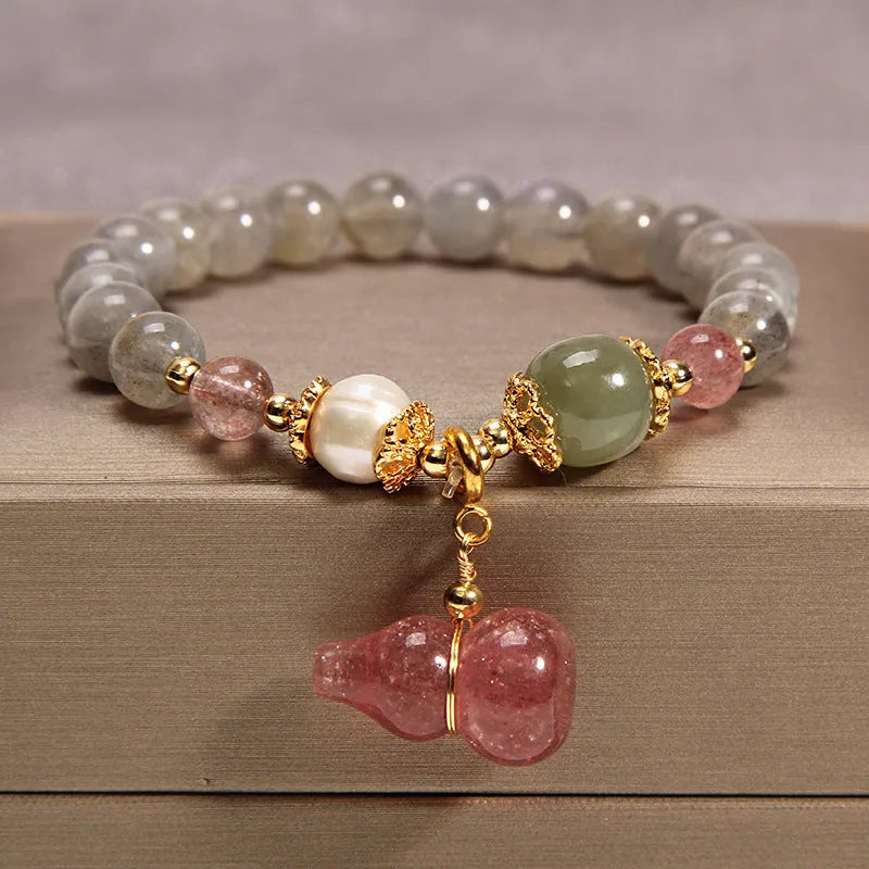 Natural garnet multi-layer crystal bracelet with strawberry quartz, moonstone, and pendant details in Korean light luxury style