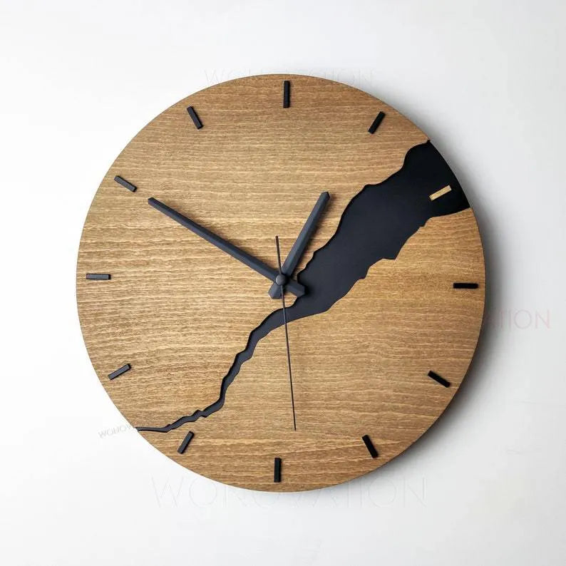 Modern simple wooden wall clock with crack design on a plain wall