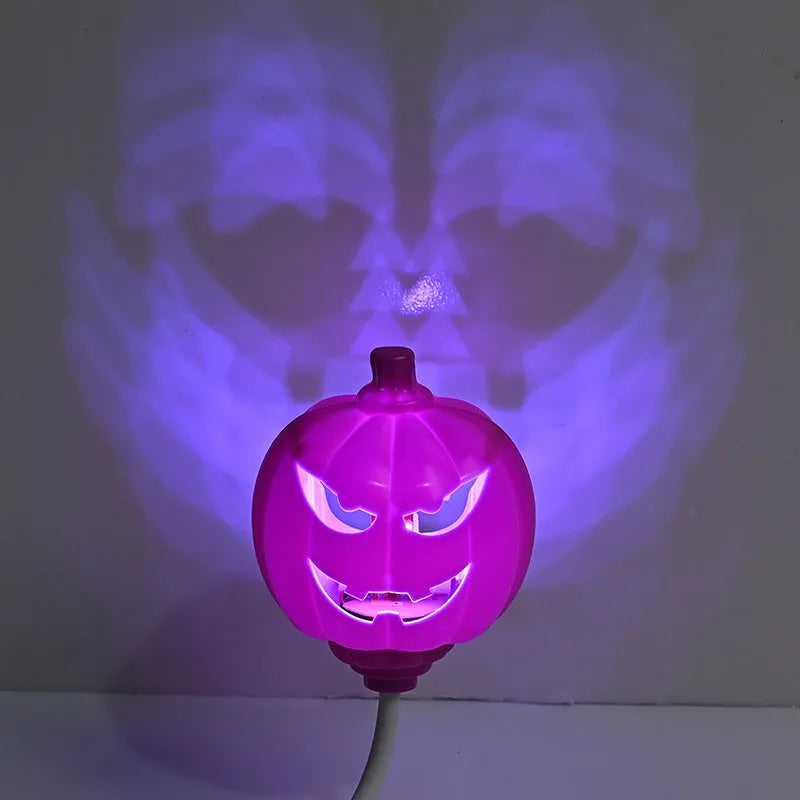 Plastic pumpkin-shaped USB lamp emitting yellow or purple light, 8.3cm wide by 22cm tall