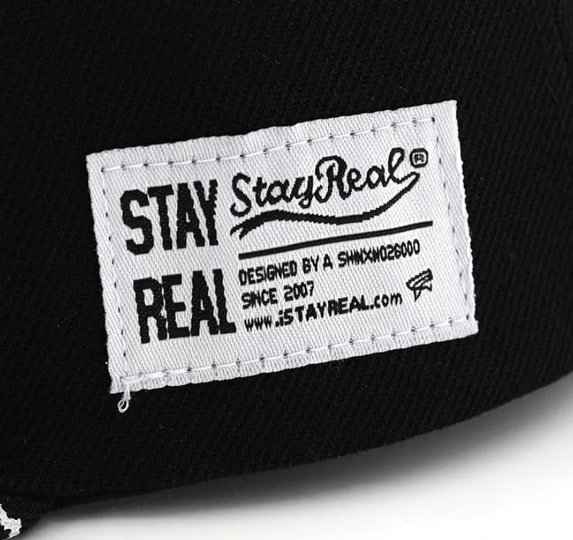 Cotton baseball cap with embroidered lettering in black or white with adjustable strap
