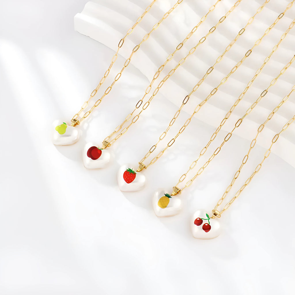 Fruit charm necklace with adjustable chain showing strawberry, pineapple, apple, pear and cherry pendant options
