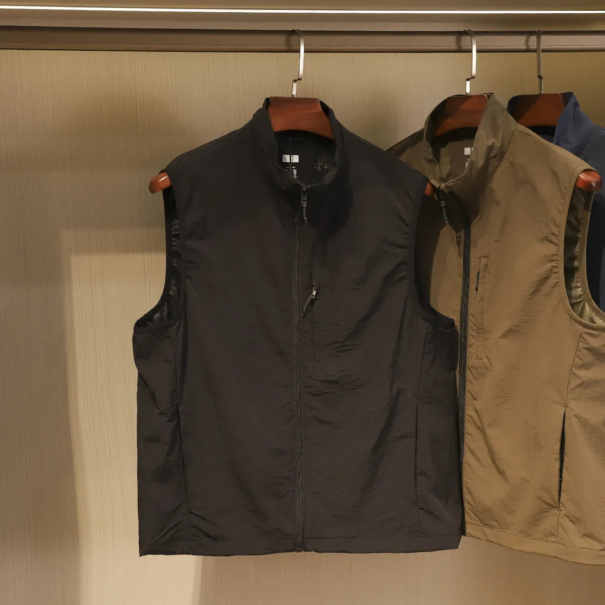 Men's thin nylon vest in Army Green, showing cardigan style and side seam pocket.