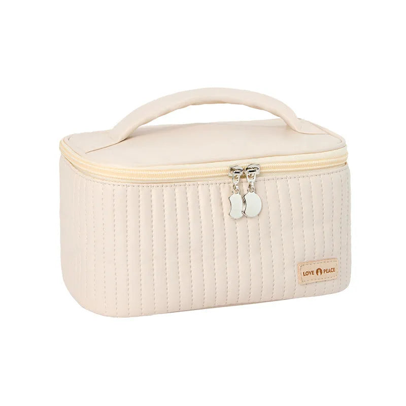 Open-top solid colour PU leather makeup bag in light blue on a white surface
