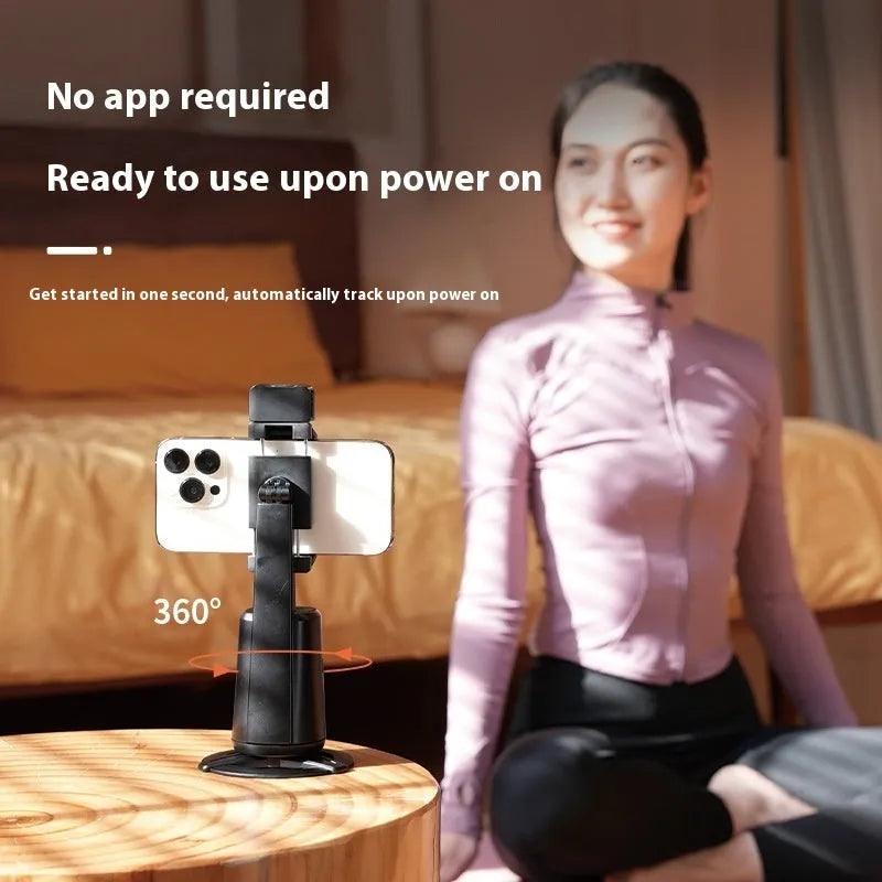 Black desktop smartphone bracket with intelligent face tracking and rotating camera head with ribbon lights