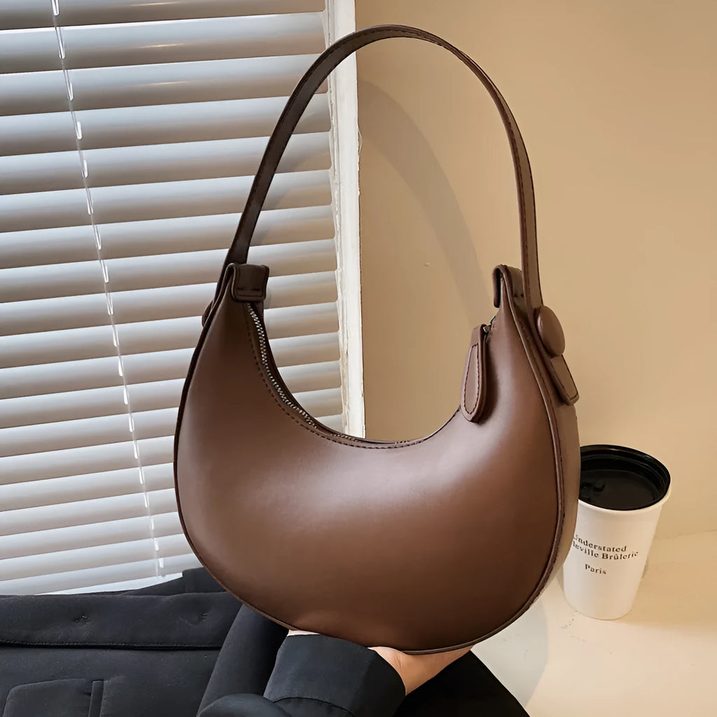Retro-style women's dumpling-shaped shoulder bag in PU, shown in one of four colours.